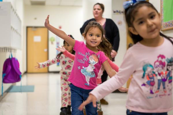 Early childhood students in a school hallway